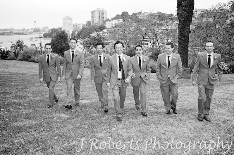 Groom walking in a line with groomsmen - wedding photography sydney